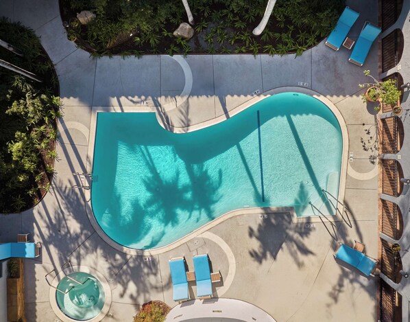 Outdoor pool, open 7:00 AM to 7:00 PM, pool loungers