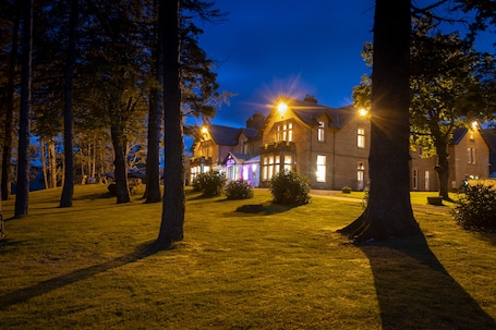 Front of property – evening/night. Ledgowan Lodge Hotel