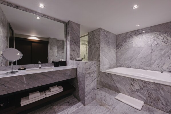 Suite, 1 King Bed | Bathroom | Hair dryer, bathrobes, towels, soap