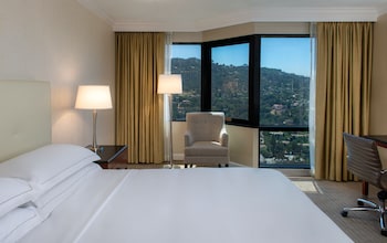 Hotel amenities such as safe, desk and work area at Hilton Los Angeles/Universal City