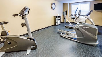 A fitness center with treadmills and an elliptical machine.