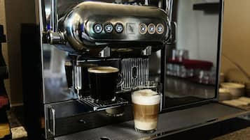 A Nespresso coffee machine on a granite countertop.