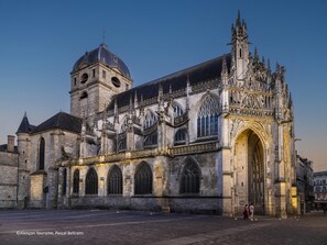 A historic cathedral with Gothic architecture, featuring a prominent tower and intricate facade.