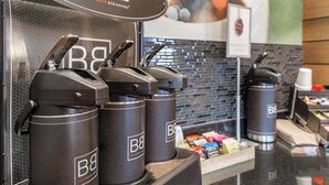 A coffee station with multiple coffee dispensers labeled 'B&B' and a sign indicating 'Bold Beginnings'. - Fairfield Inn & Suites Sioux Falls (Sioux Falls)