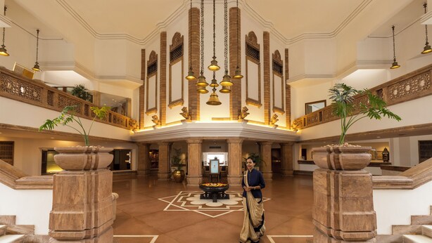 A grand lobby with a central fountain, high ceilings, and ornate railings. - Trident, Bhubaneswar (Bhubaneshwar)