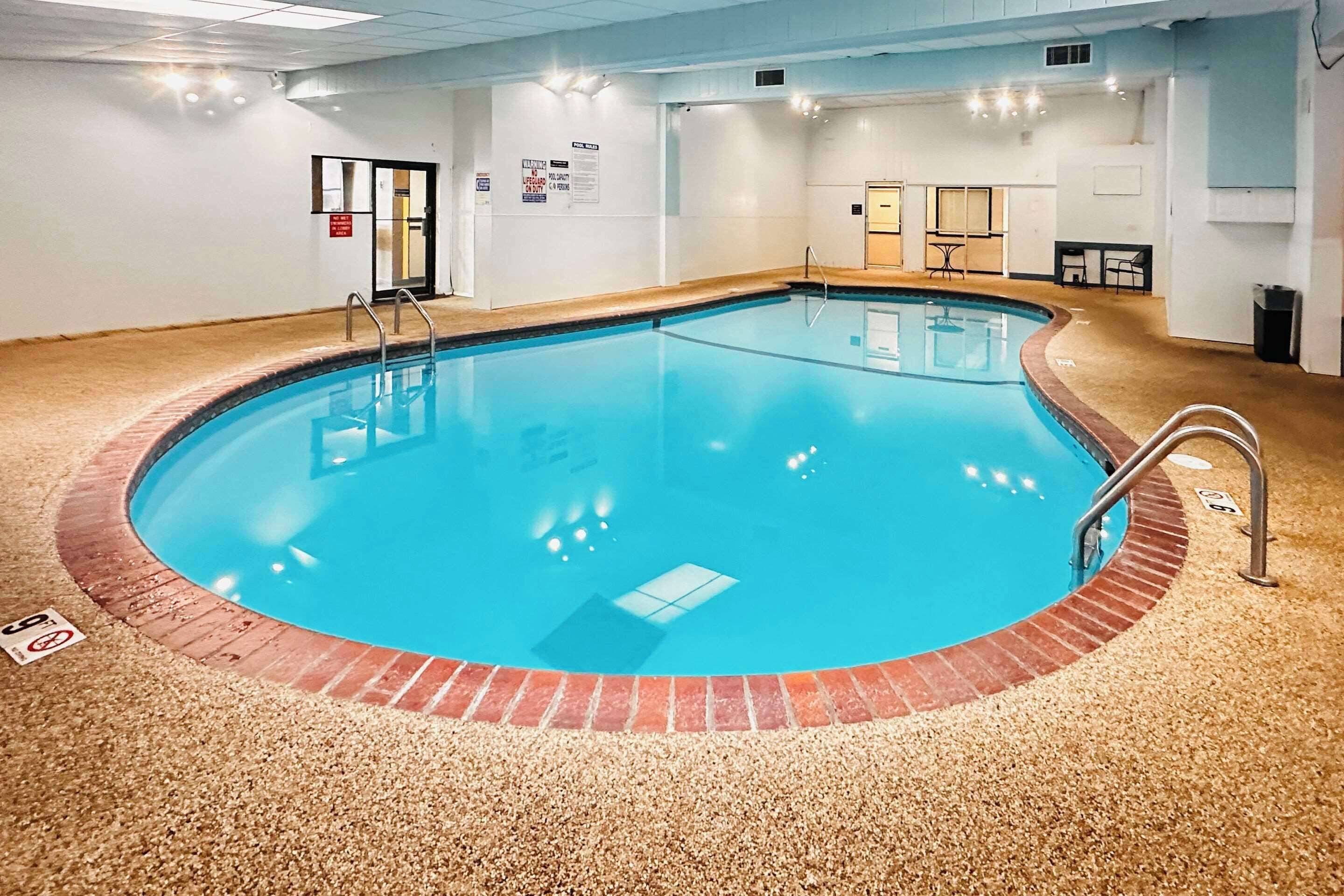 Indoor pool, open 7 AM to 11 PM, sun loungers