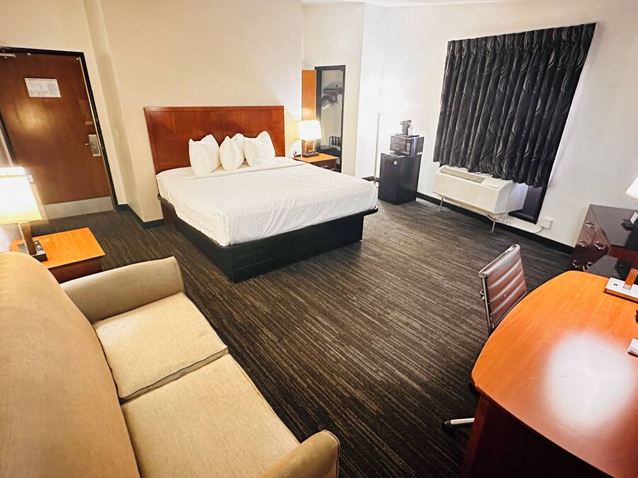Suite, 1 King Bed with Sofa bed, Non Smoking | Desk, laptop workspace, iron/ironing board, free cribs/infant beds
