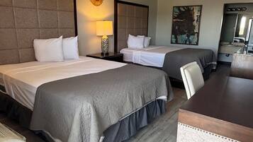 Habitación ejecutiva, 2 camas Queen size | Escritorio, cortinas blackout, wifi gratis y ropa de cama