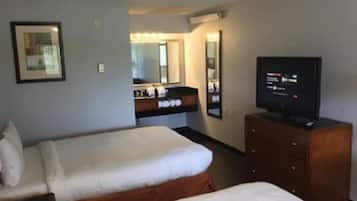 Habitación ejecutiva, 2 camas Queen size | Escritorio, cortinas blackout, wifi gratis y ropa de cama