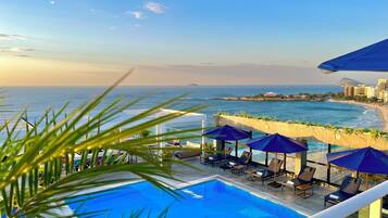 Outdoor pool, pool umbrellas, sun loungers