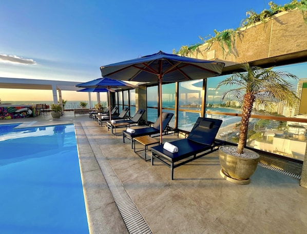 Outdoor pool, pool umbrellas, sun loungers