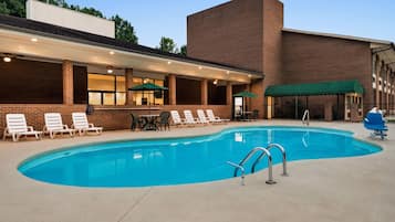 Seasonal outdoor pool, open 9:00 AM to 9:00 PM, pool umbrellas