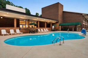 Seasonal outdoor pool, open 9:00 AM to 9:00 PM, pool umbrellas