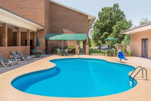 Seasonal outdoor pool, open 9:00 AM to 9:00 PM, pool umbrellas