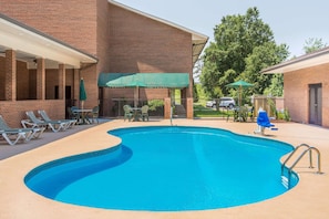 Seasonal outdoor pool, open 9:00 AM to 9:00 PM, pool umbrellas