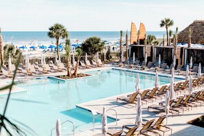 Outdoor pool, open 8:00 AM to midnight, pool umbrellas, sun loungers