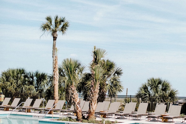 Outdoor pool, open 8:00 AM to midnight, pool umbrellas, pool loungers