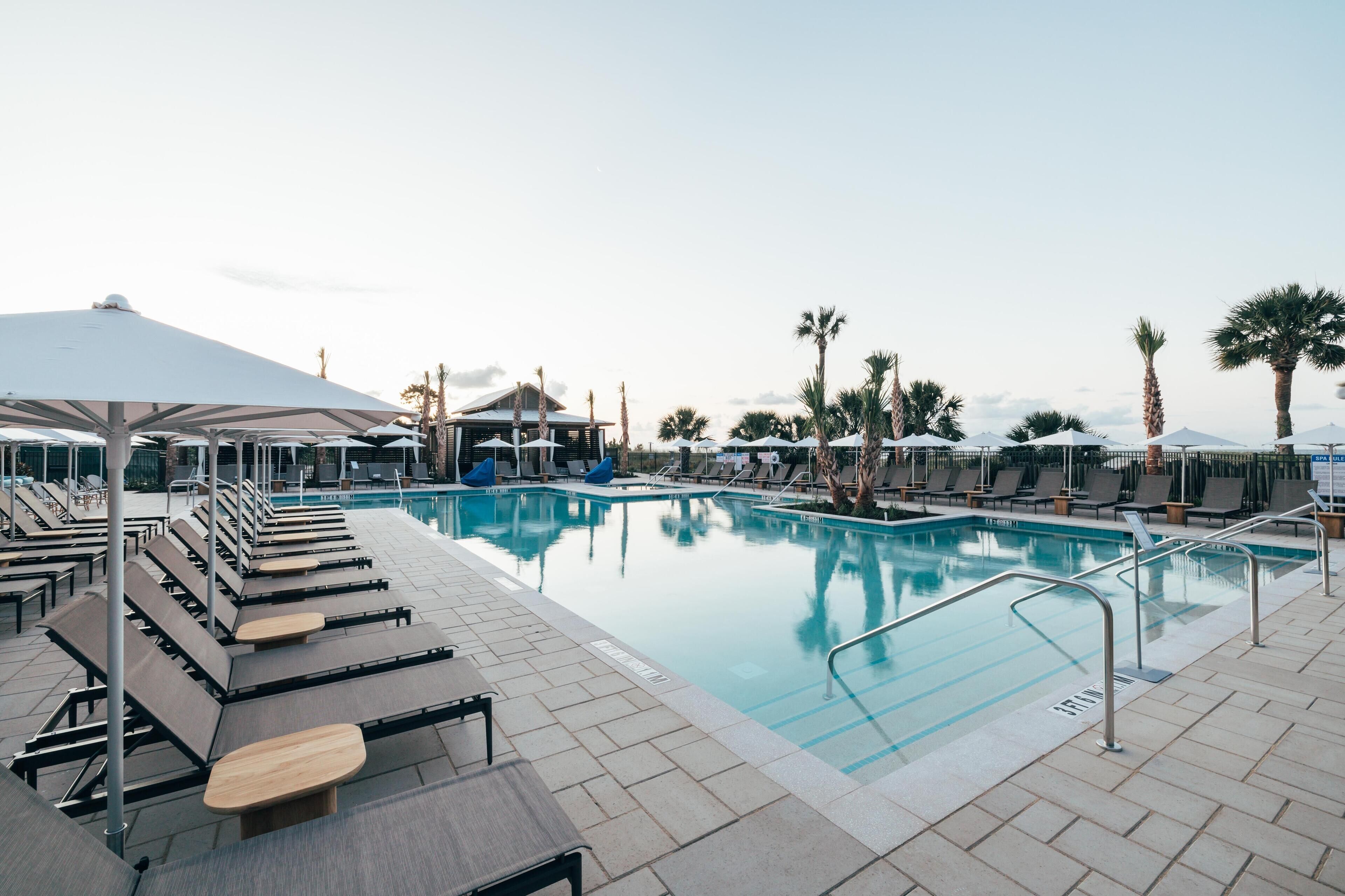 Outdoor pool, open 8:00 AM to midnight, pool umbrellas, sun loungers