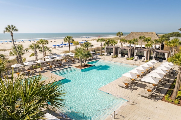 Outdoor pool, open 8:00 AM to midnight, pool umbrellas, sun loungers