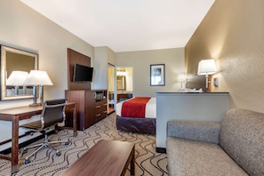 Premium bedding, desk, laptop workspace, blackout drapes