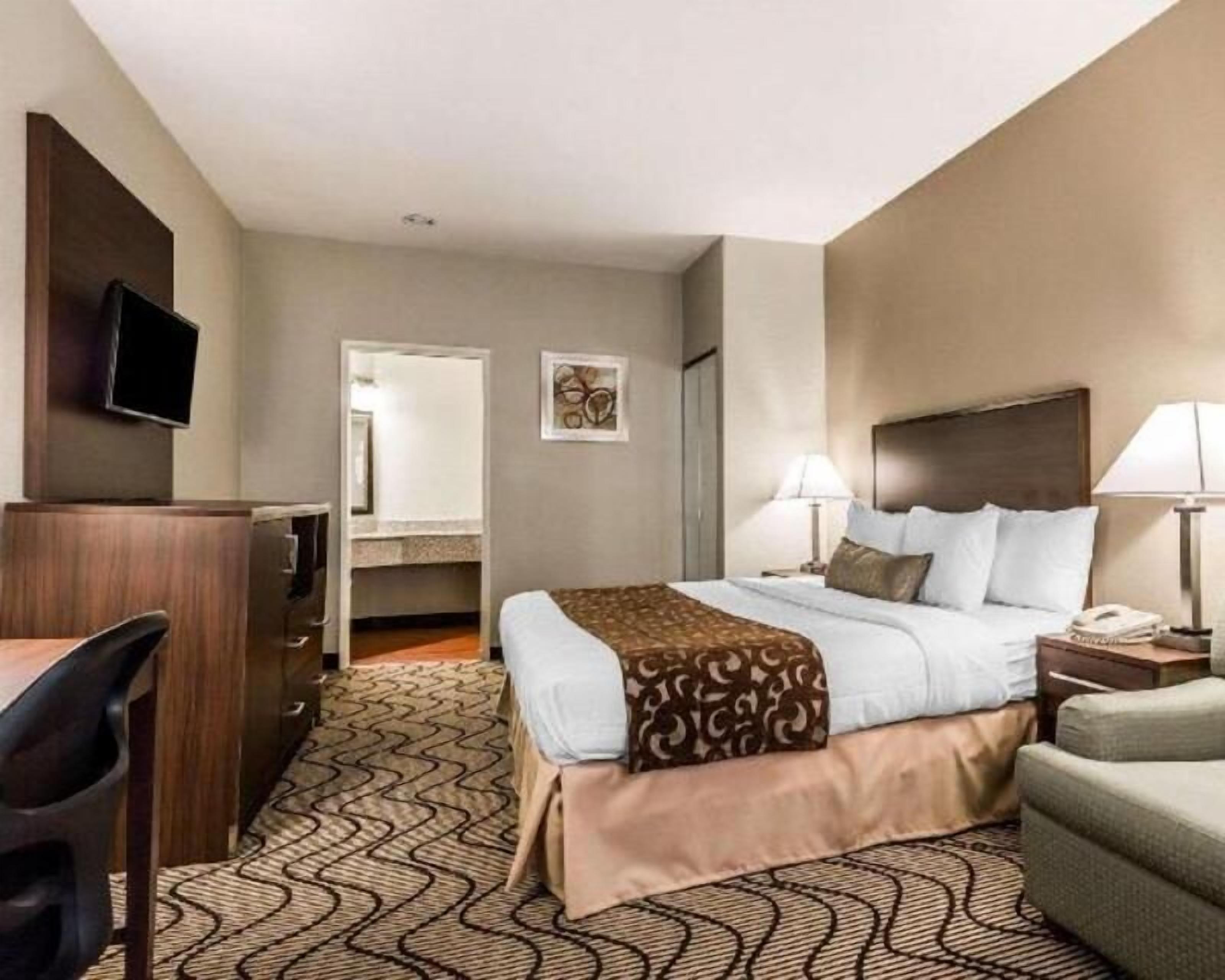 Premium bedding, desk, laptop workspace, blackout curtains