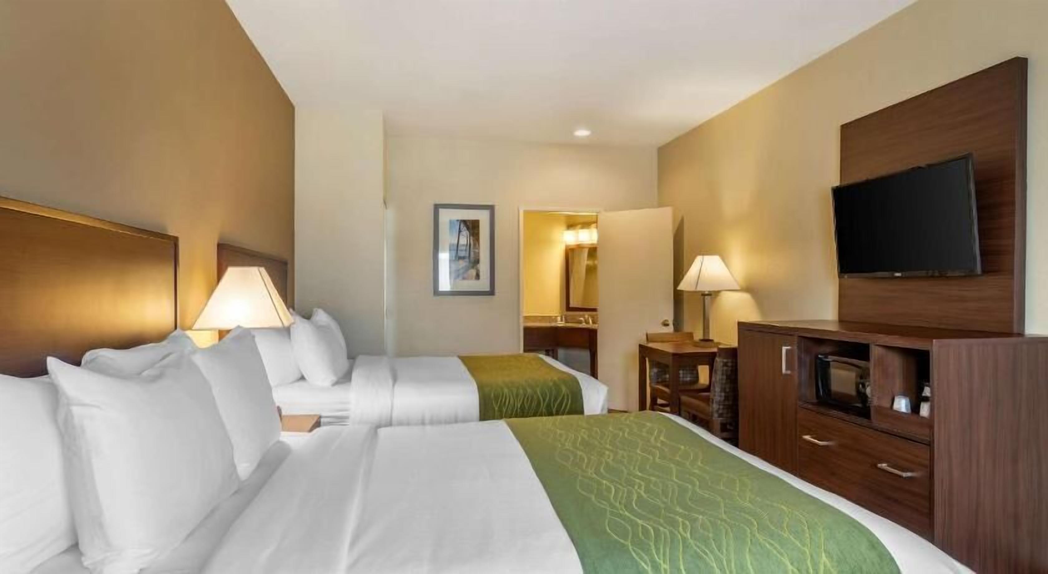 Premium bedding, desk, laptop workspace, blackout curtains