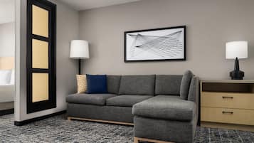 Premium bedding, desk, laptop workspace, blackout drapes