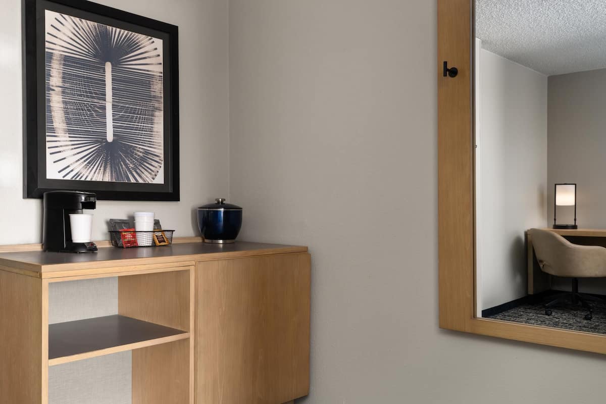 Premium bedding, desk, laptop workspace, blackout drapes