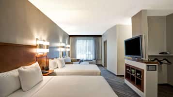 Premium bedding, desk, laptop workspace, blackout curtains