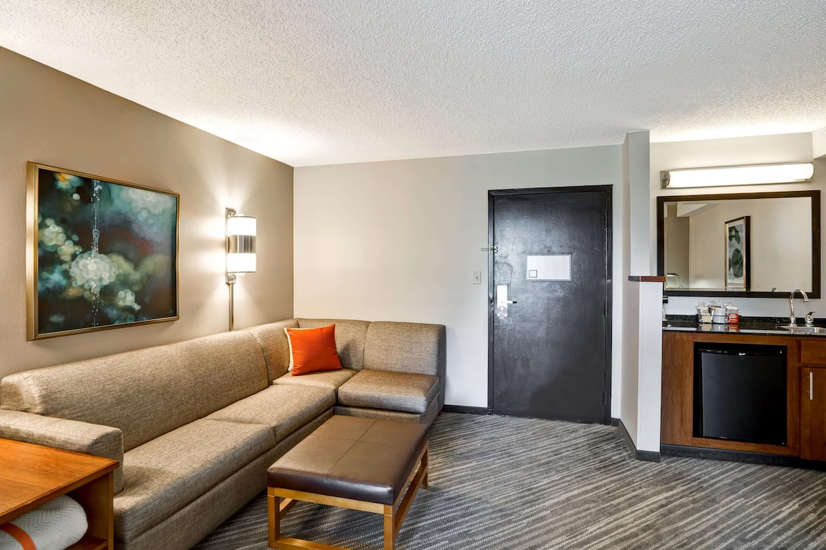 Premium bedding, desk, laptop workspace, blackout curtains