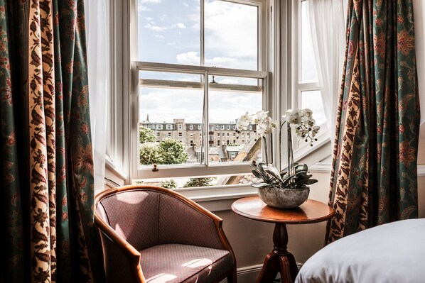 Desk, laptop workspace, iron/ironing board, travel cot