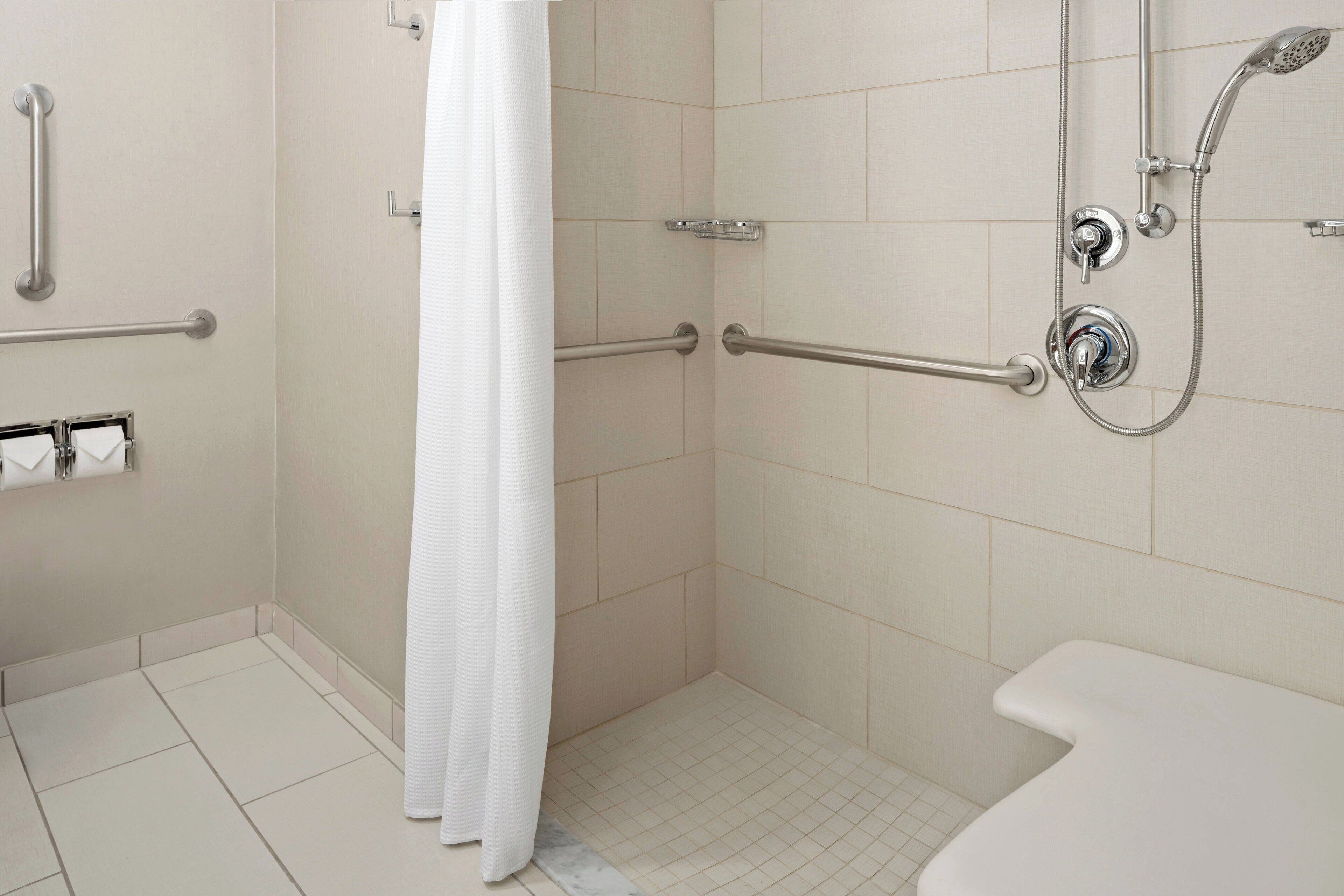 studio, 1 king bed, non smoking (mobility/hearing access, roll-in shwr) | bathroom | hair dryer, towels, soap, shampoo