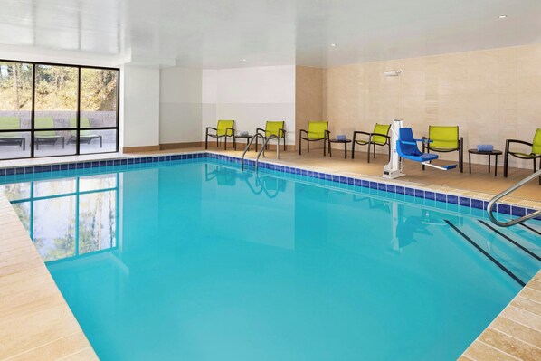 Indoor pool, open 6:00 AM to 11:00 PM, pool loungers