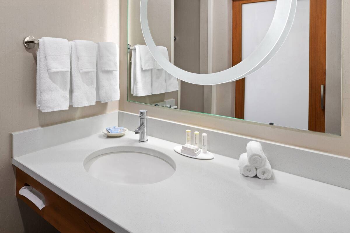 premium bedding, desk, blackout curtains, iron/ironing board