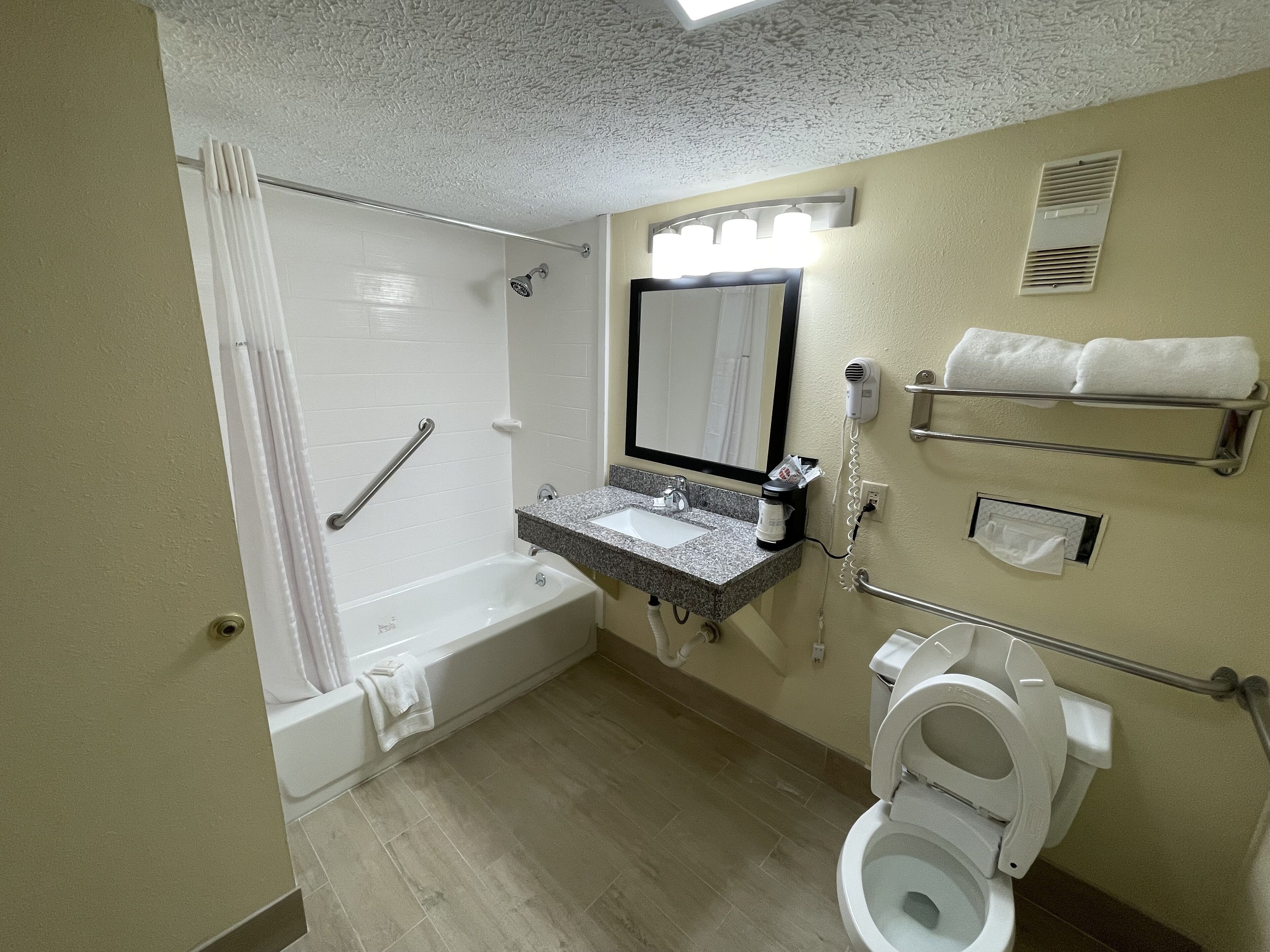 combined shower/bathtub, free toiletries, hair dryer, towels