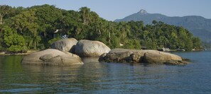 Surrounded by lush greenery and mountains, this lakeside setting offers a tranquil environment for relaxation and outdoor activities.