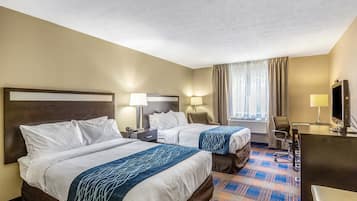 Premium bedding, desk, laptop workspace, blackout curtains