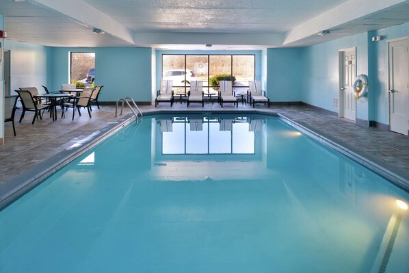 Indoor pool, open 9:00 AM to 9:00 PM, pool loungers