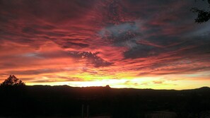 Mountain vistas unfold against a kaleidoscope of colors at sunset.