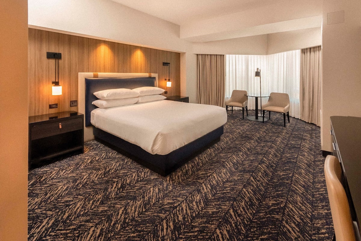 Premium bedding, desk, laptop workspace, blackout curtains