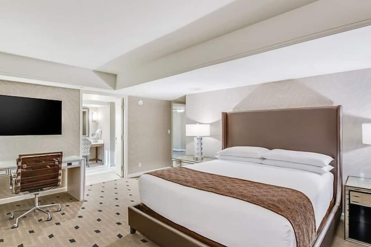 Premium bedding, desk, laptop workspace, blackout curtains