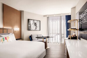 Premium bedding, desk, laptop workspace, blackout drapes
