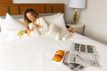 Premium bedding, desk, laptop workspace, blackout drapes at Caesars Republic Lake Tahoe - A Caesars Rewards Destination