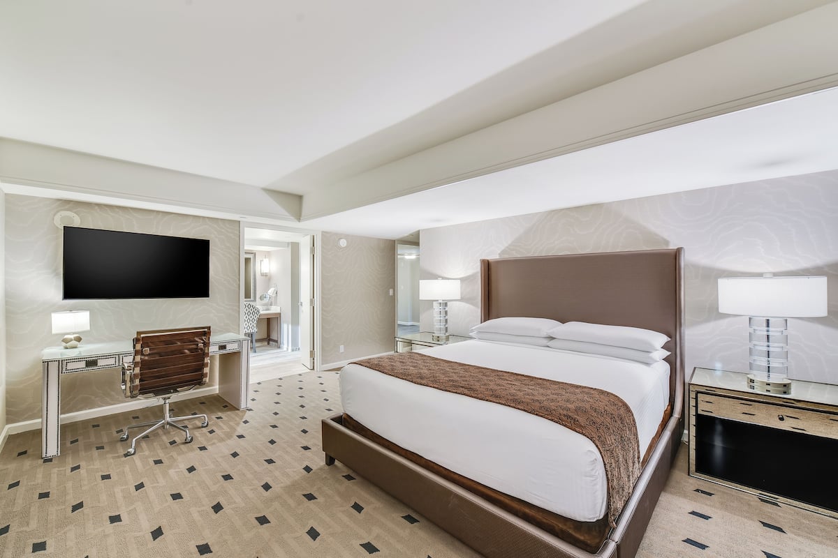 Premium bedding, desk, laptop workspace, blackout curtains