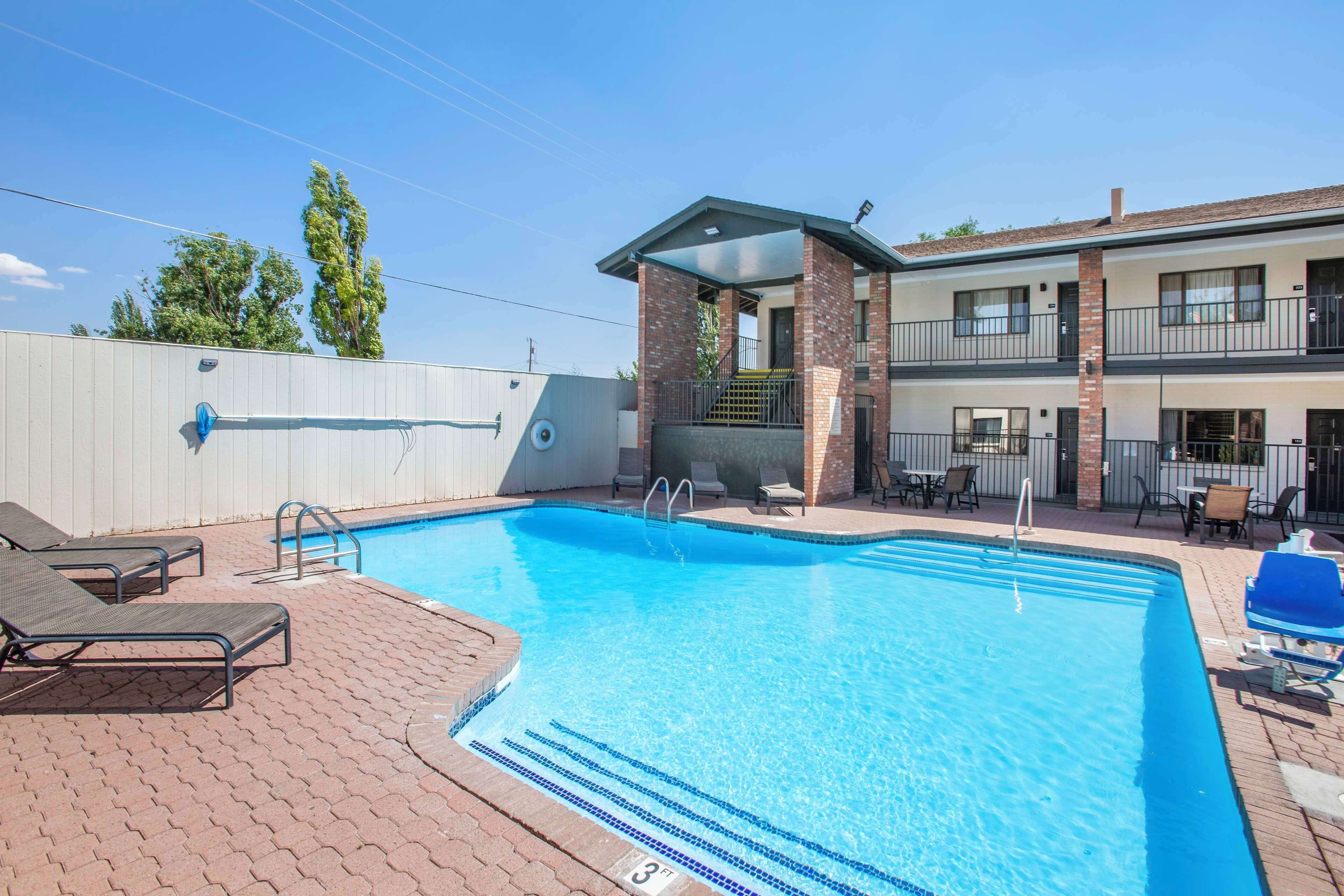 Seasonal outdoor pool, pool loungers