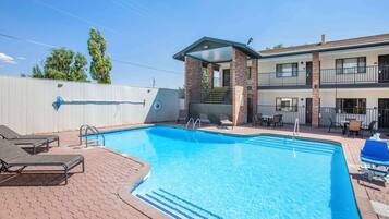 Seasonal outdoor pool, pool loungers