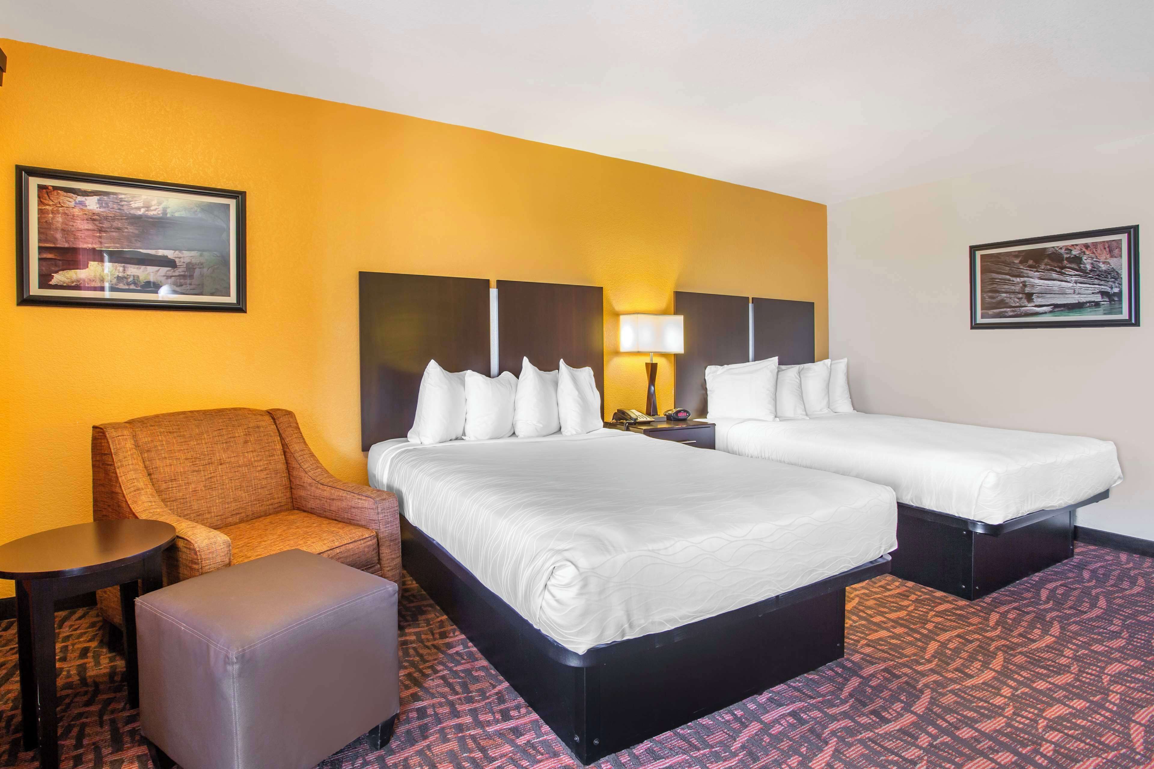 Desk, laptop workspace, iron/ironing board, bed sheets