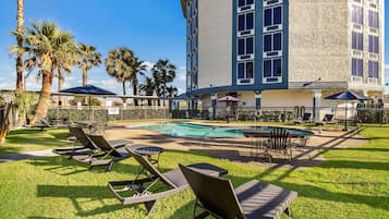 Seasonal outdoor pool, open 9:00 AM to 10:00 PM, sun loungers