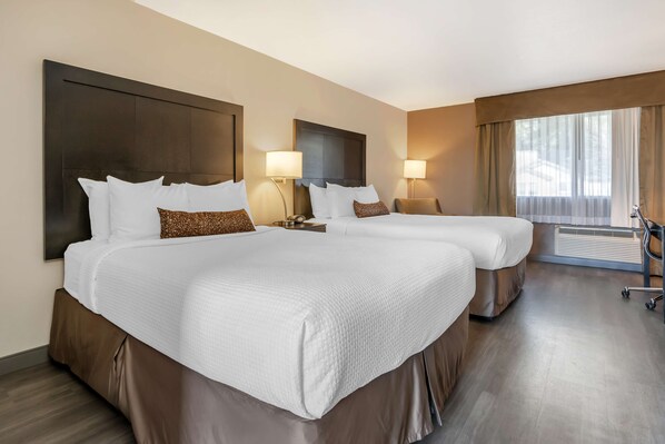 A hotel room with two beds, a large window with curtains, a desk, and a chair. - Best Western Inn Of Vancouver (Vancouver)