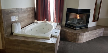 Suite, 1 King Bed, Non Smoking, Jetted Tub (2nd Floor) | Desk, laptop workspace, iron/ironing board, free WiFi